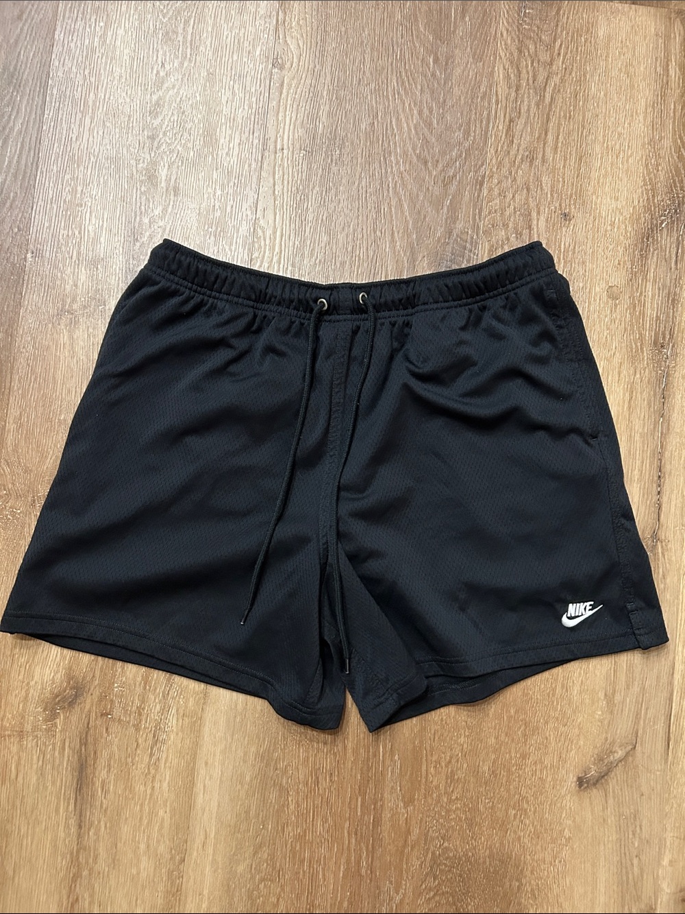 Nike Men's Black Athletic Mesh Shorts with White Swoosh